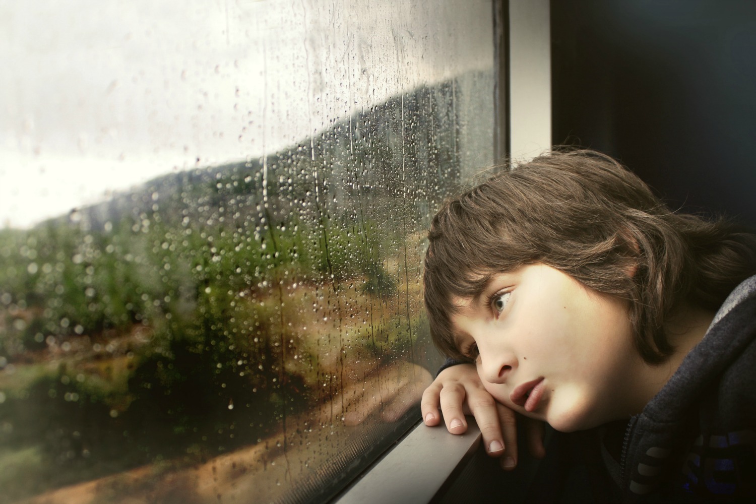 kid looking out window