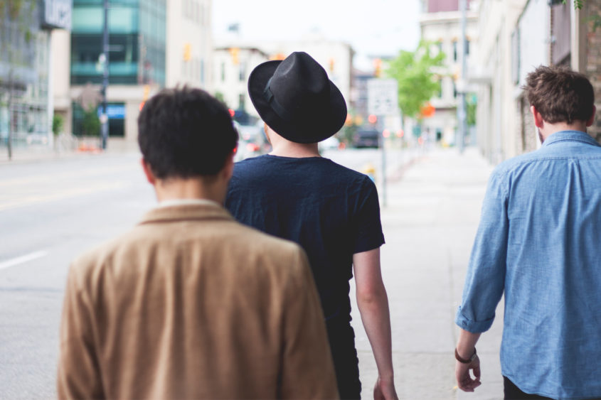 men walking down streets